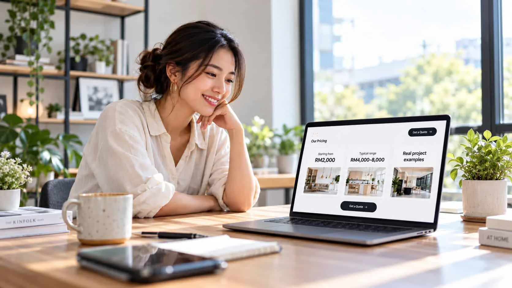 A small business owner smiling at her laptop, looking at a website pricing section that shows a starting price of RM 2,000, a typical range of RM 4,000–8,000 and real project examples, with a Get a Quote button